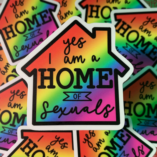 This rainbow sticker is shaped like a house, with "yes I am a HOME of Sexuals" written within the house.